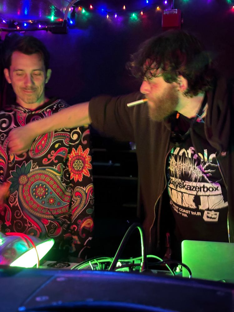 Heartworm trying to snatch a kazoo out of dj 0.000001's hand 