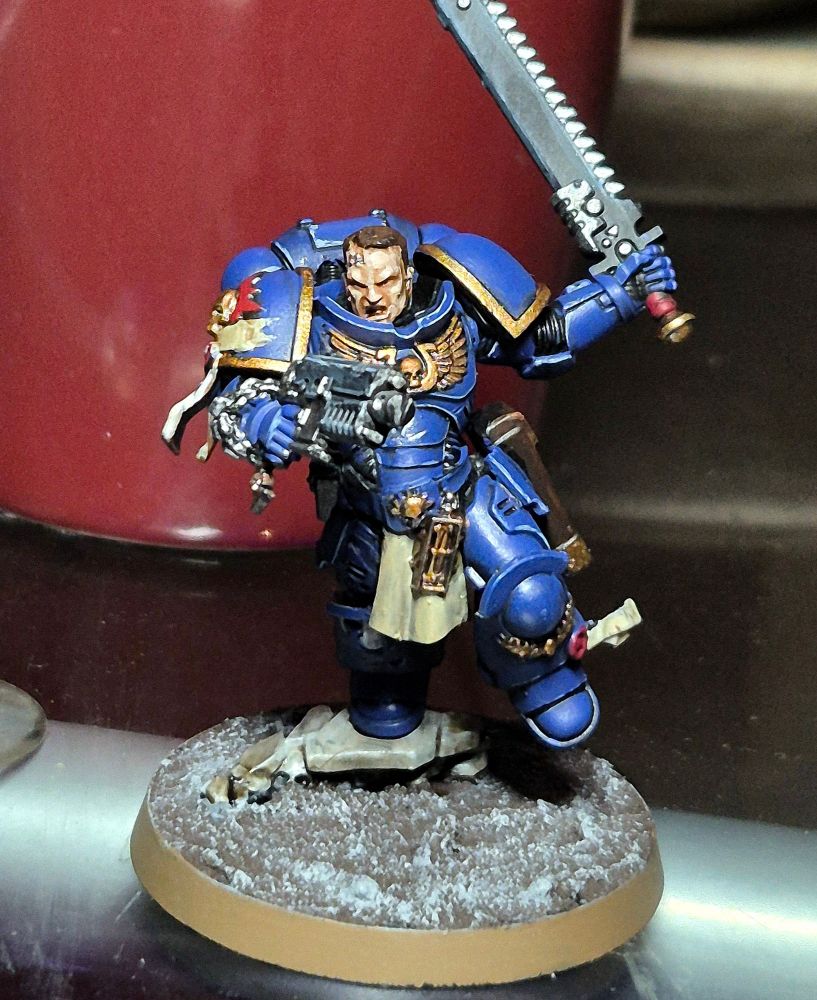 A fairly well painted Warhammer 40k Space Marine model.