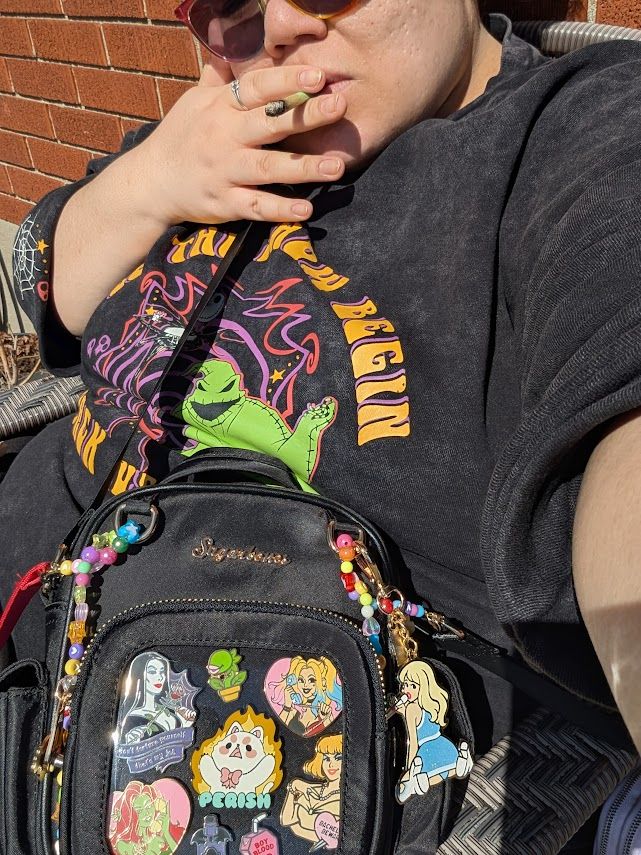 picture of me smoking in the sun wearing my new birthday star bag by sugarbones featuring sugarbones pins and the perish one by trendynot!