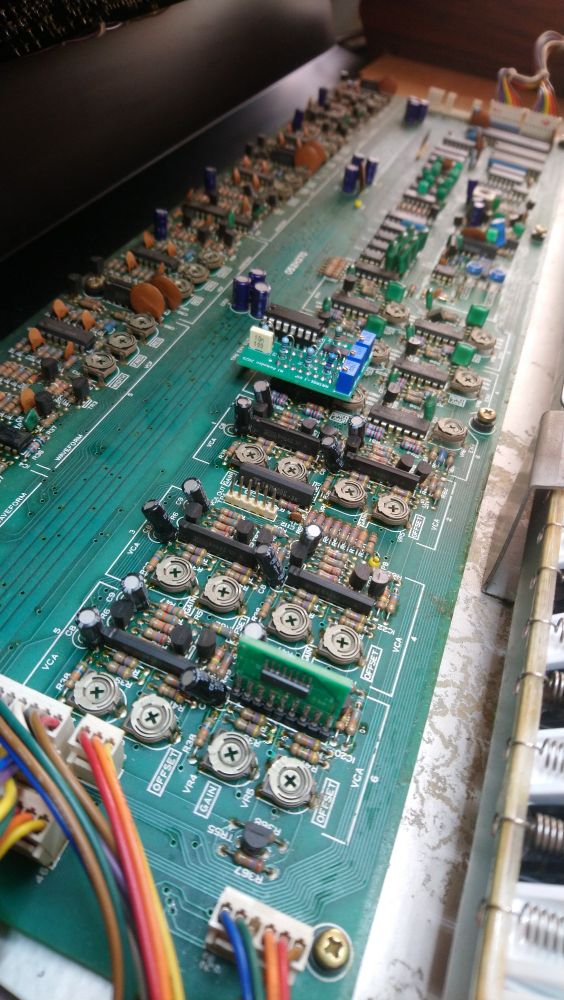 The guts of a Roland Juno 6 in which I've installed two custom boards to replace broken original parts, now unobtanium. 