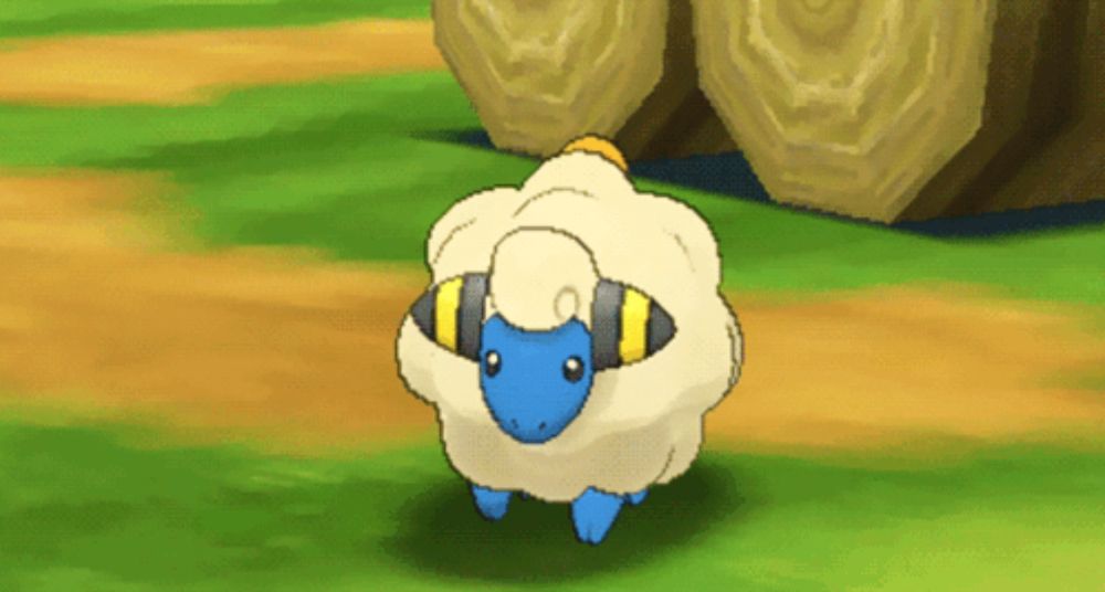 a cartoon sheep with a blue face and yellow stripes on its head