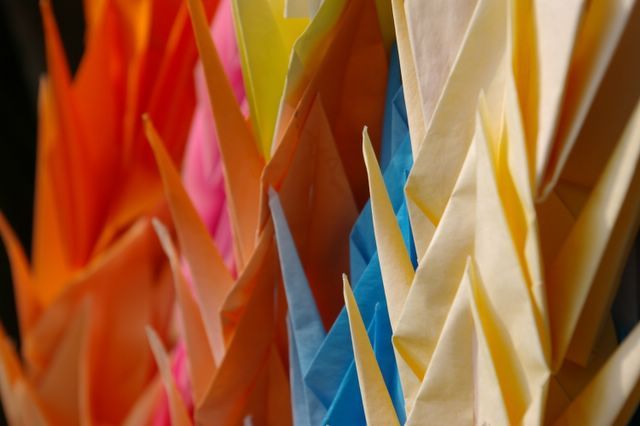 close up shot of origami birds, various colours