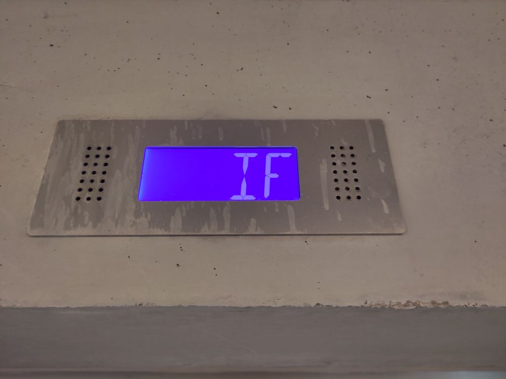 An illuminated sign showing IF.