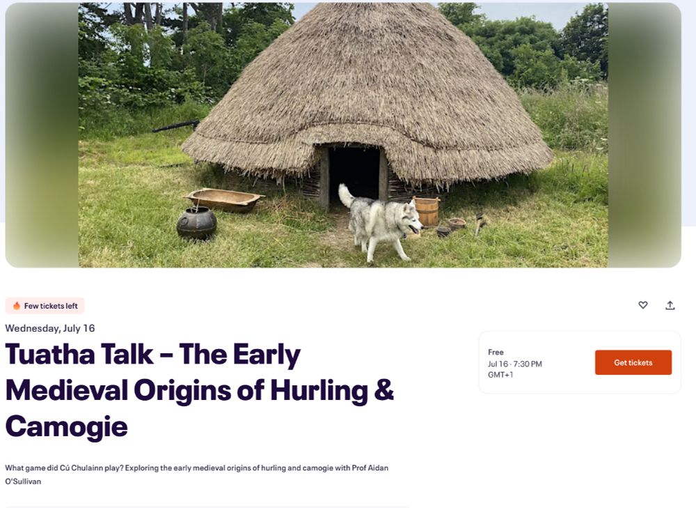 Large dog in front of reconstruction early medieval house 