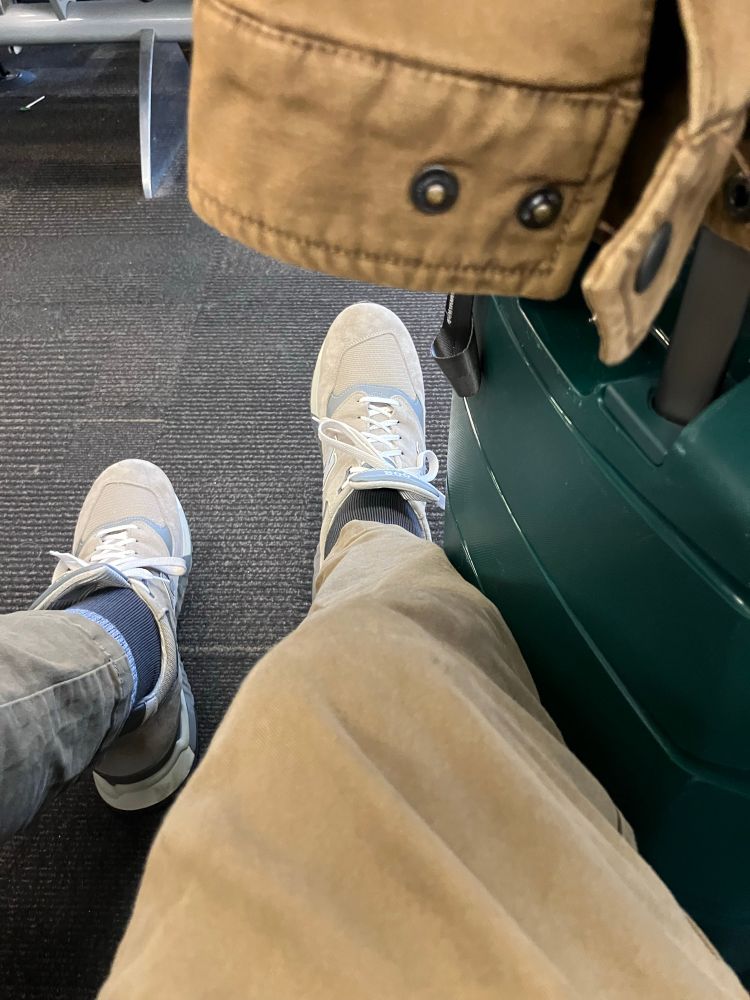 Size 16 shoes and long legs to fit on a plane.