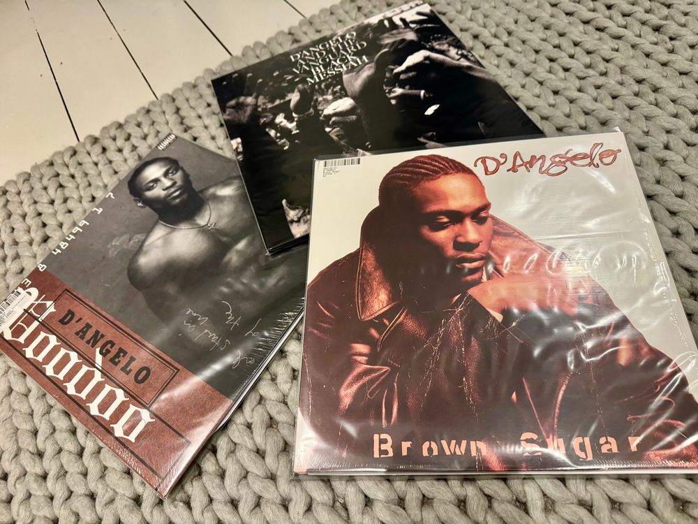 Three albums by D’Angelo next to each other. 
