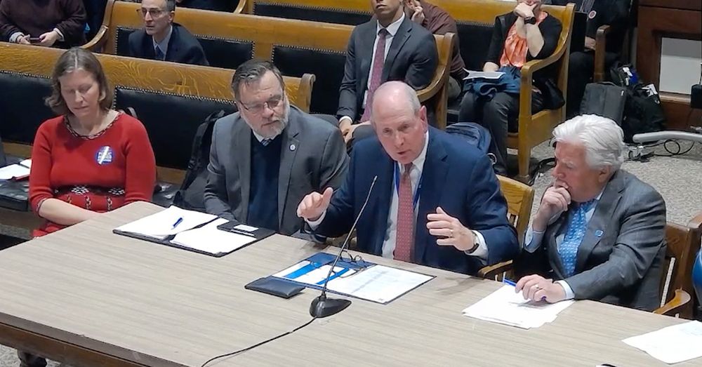 UMass Chan Chancellor Michael F. Coilins testifying on DRIVE before a legislative committee on Oct. 30, 2025