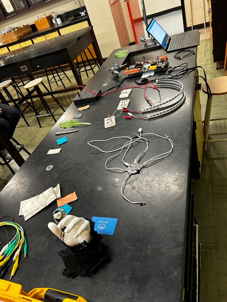 Image of a black table top with electronic components used for demonstration. 