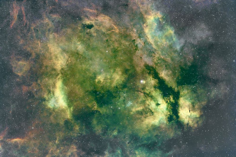 Colorful nebulosity ranging from rose in outer circular ring to greens and blues closer to central star Sadr. More details and easier versions in my gallery: https://app.astrobin.com/i/dmgv0y?r=C