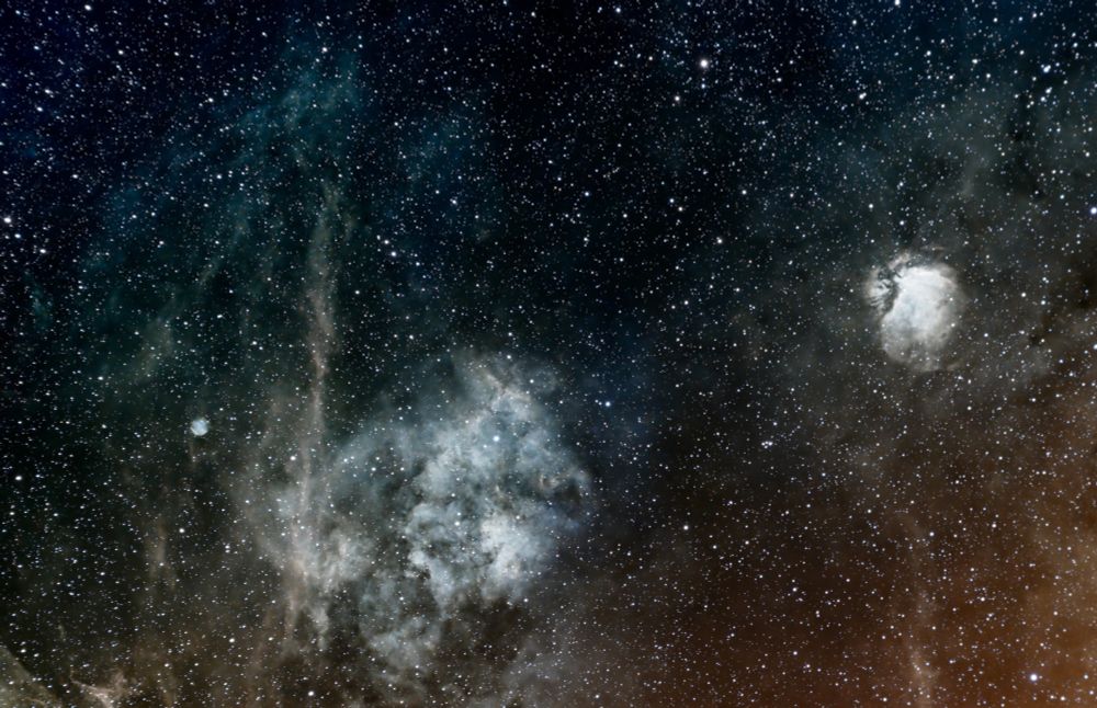 On lower left a large blue-green nebula with pale red accents and a smaller brighter nebula in the upper right side. My wife said she sees a large fish on the lower left ready to eat a smaller one on the upper right. What do you see? More details in my gallery: https://app.astrobin.com/i/bti9te?r=C