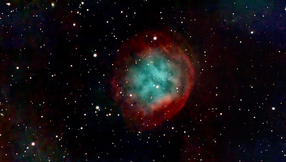 A large circular form with red and orange at the edge with green and blue in the core of the circle. More details in my gallery: https://app.astrobin.com/u/JimCase?i=7