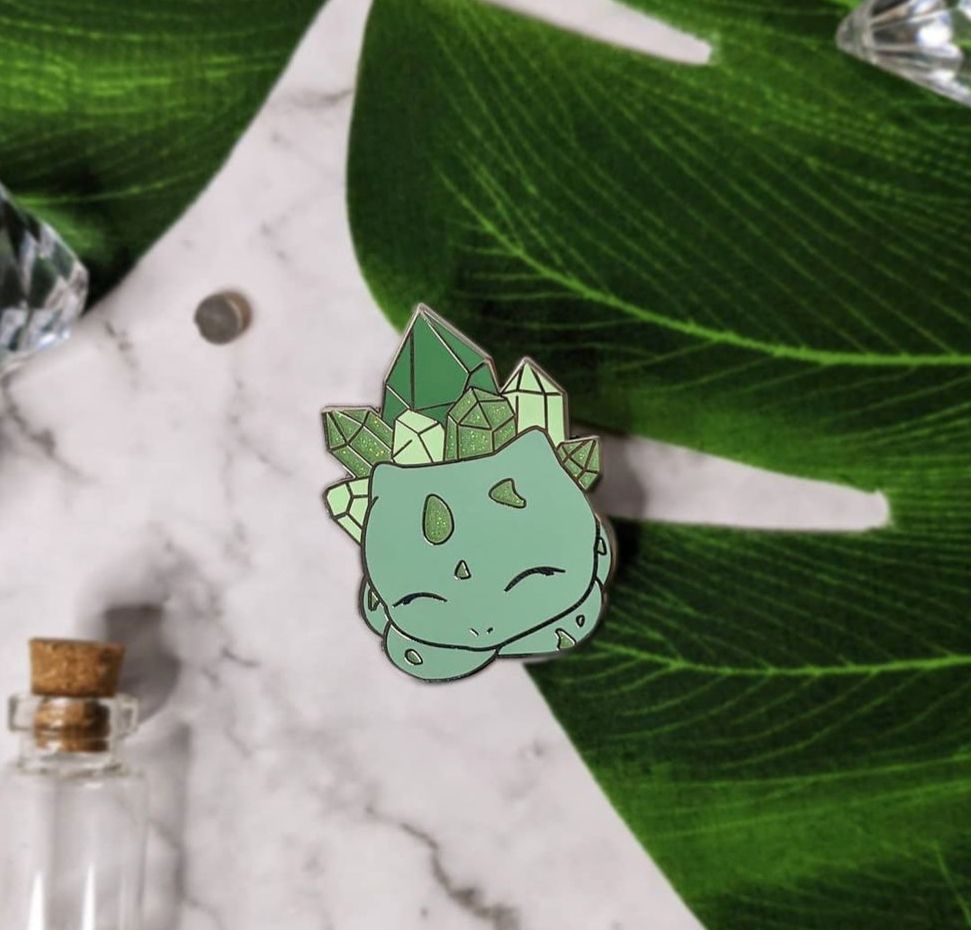 Bulbasaur enamel pin, with crystals on its back. Made by Noly Sheet