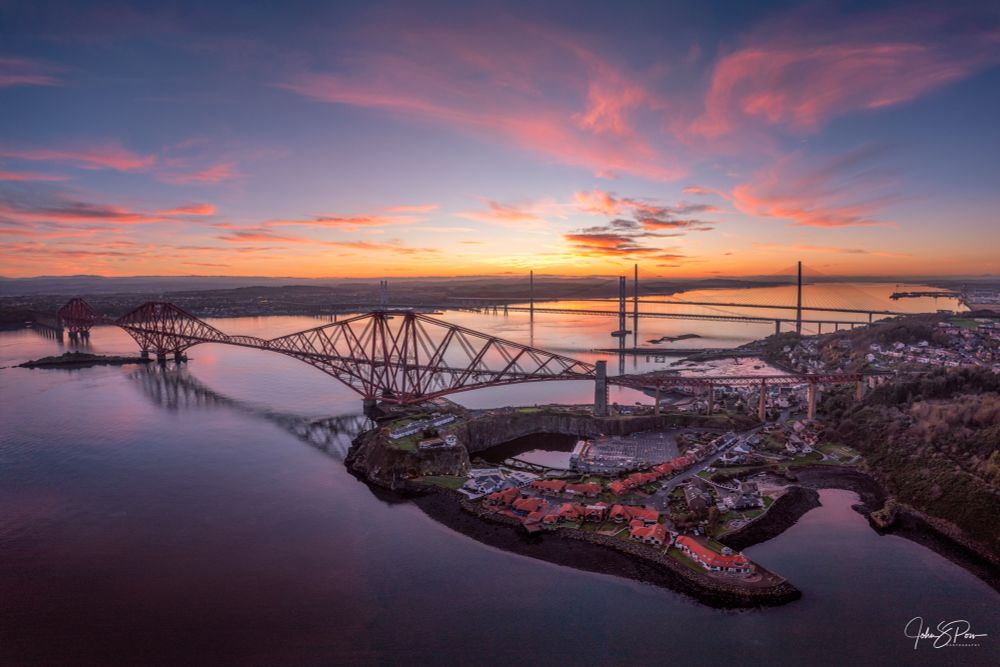 The three Forth Bridges under wonderful pink sunset skies.  