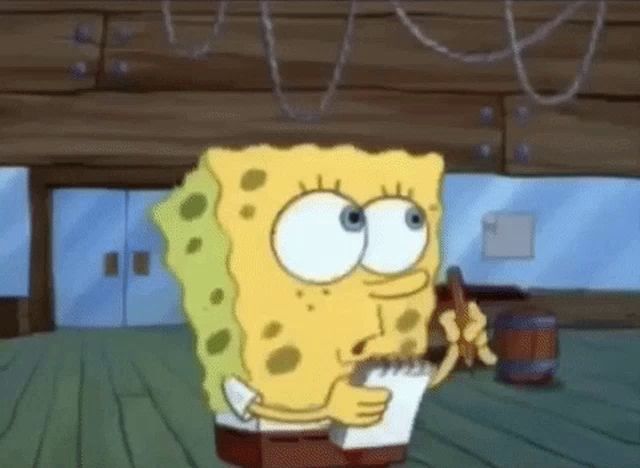 spongebob squarepants is writing on a piece of paper with a pen .