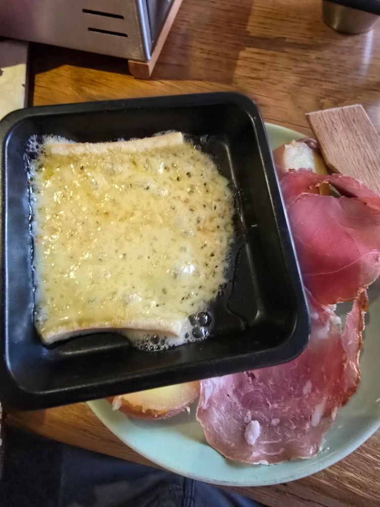 Melted cheese to pour over potatoes and meat.
