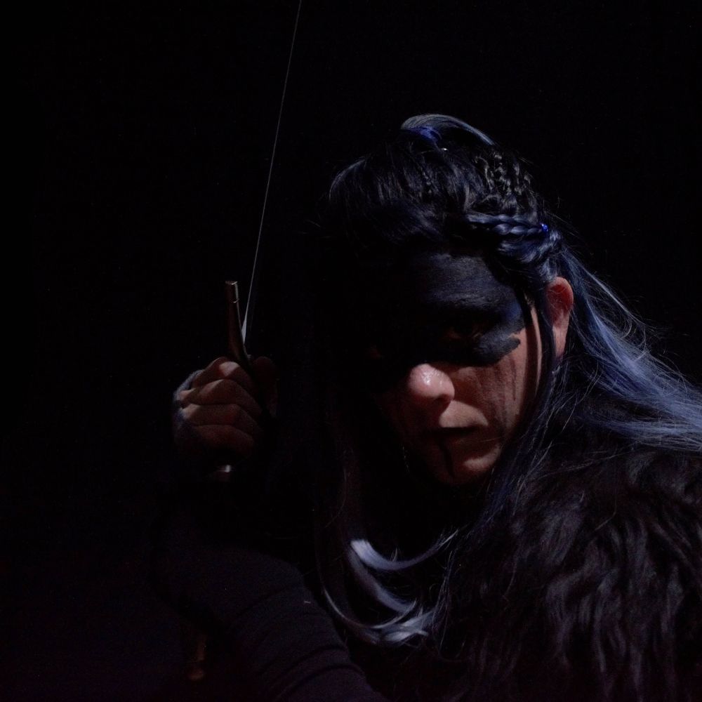 Another shot from the same set. This time my eyes are cast in darkness and you can just barely make out my hand hefting the sword as if I am about to swing it