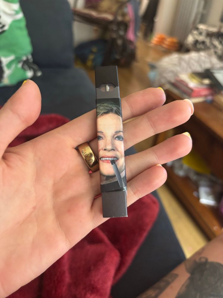 juulie andrews, my juul with a sticker of julie andrews hitting a juul 