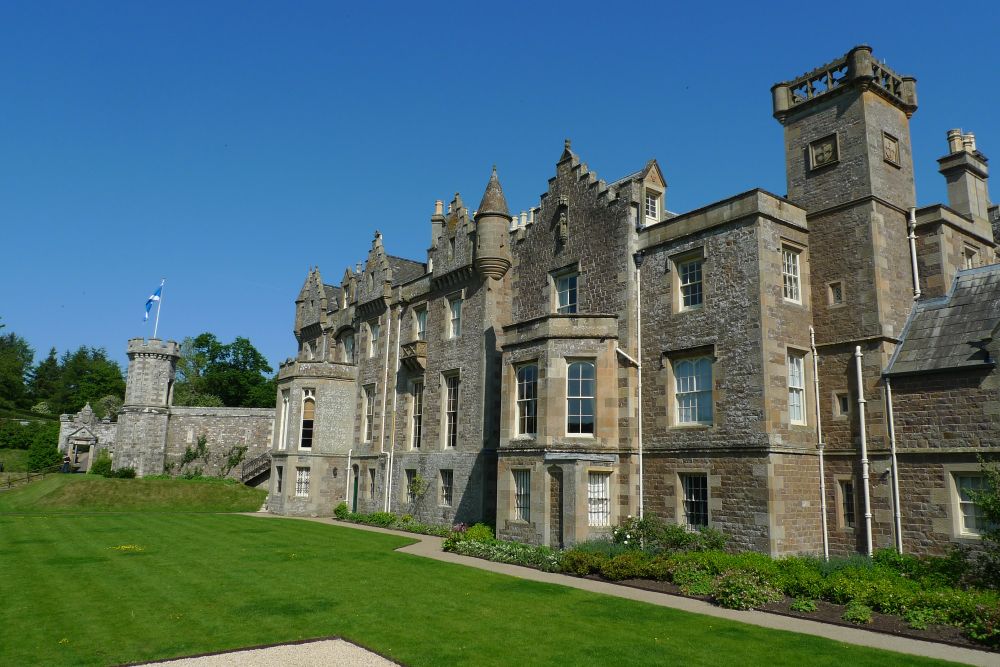 Abbotsford house, a country mansion with bay windows and turrets