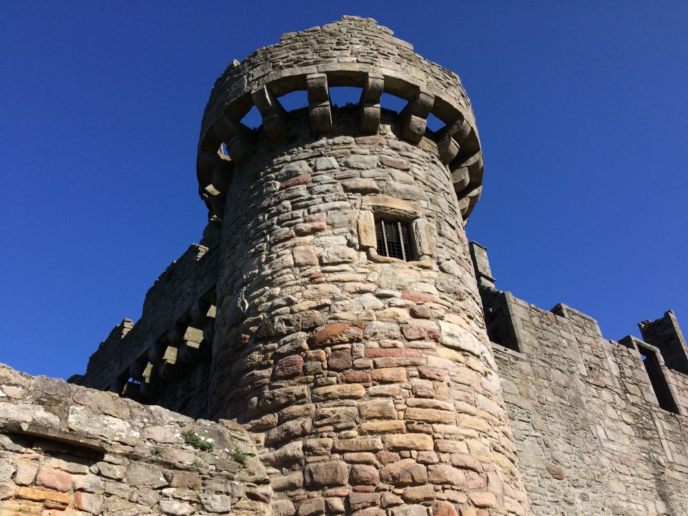 A turret of Craigmillar Castle. It has a small, square window