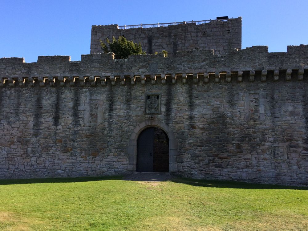 The wall of Craigmillar Castle. There's an arched door in the middle