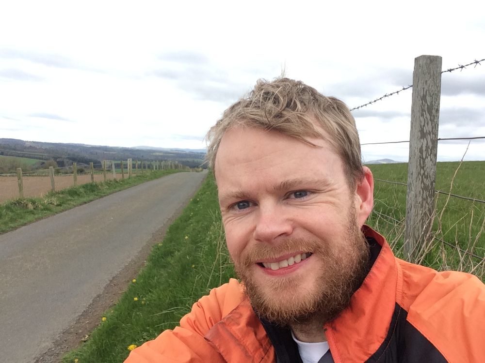 The author next to a single-track road