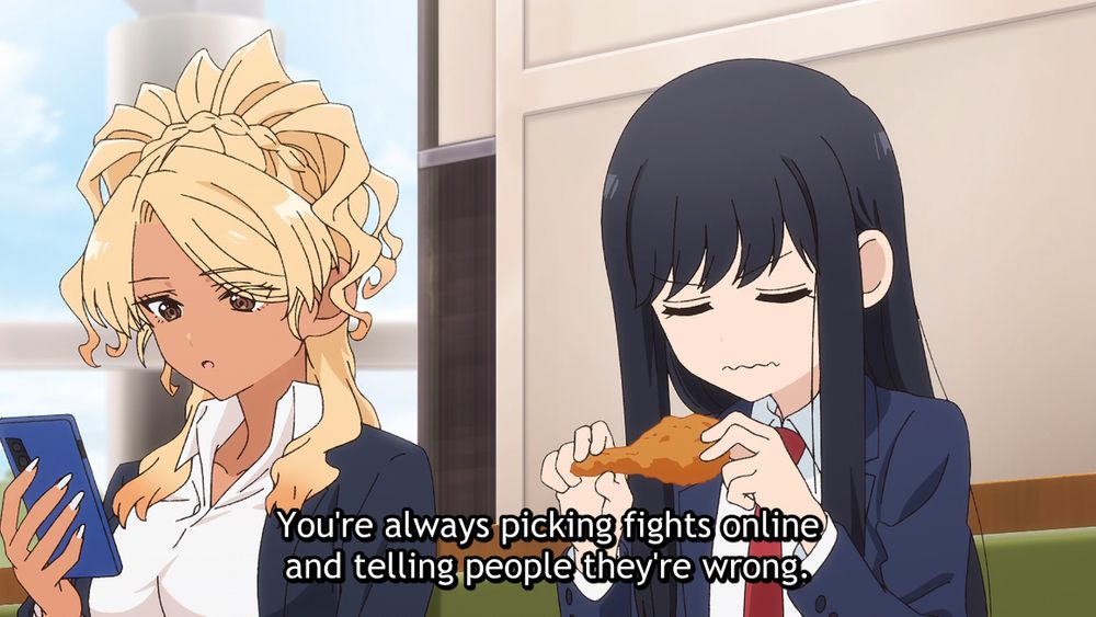 A scene from the anime See You Tomorrow at the Food Court. Two high school girls are sitting in a food court together having a conversation. One is a gyaru type character with who is looking at her phone, the other is a nervous looking girl who is grimacing as she holds a piece of fried chicken. The subtitles show that the gyaru is saying to the grimacing girl, "You're always picking fights online and telling people they're wrong."