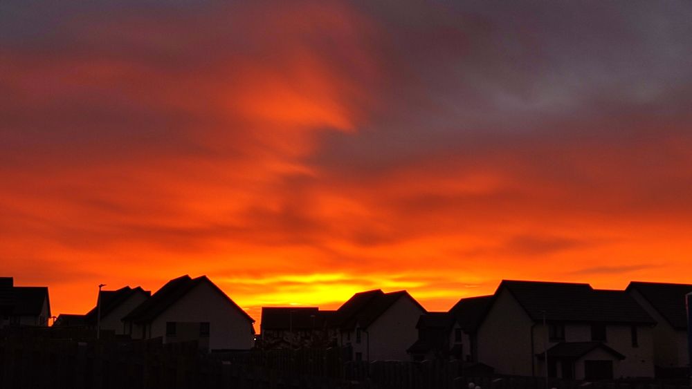 A beginnings of a bright Scottish sunrise. The sky looks red