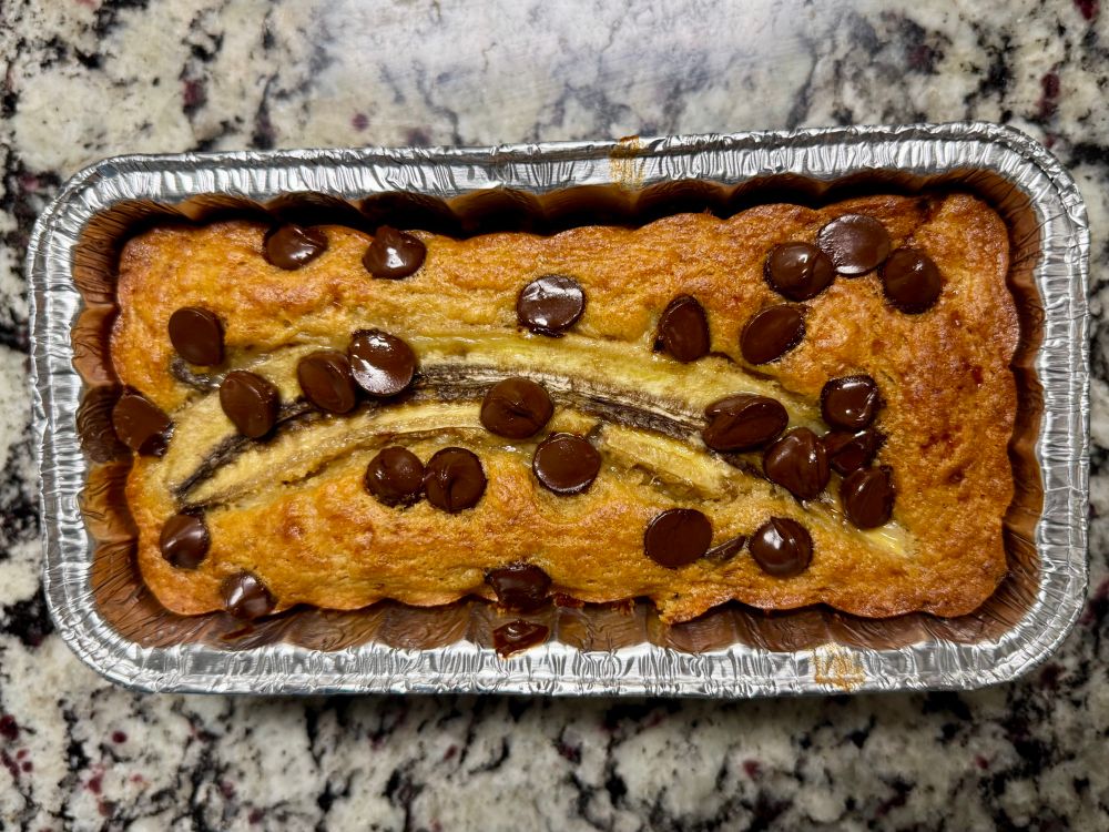 High-protein banana bread with dark chocolate chips and sliced banana