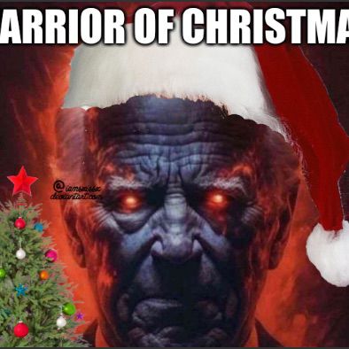 A picture of Joe Biden edited to give him a menacing aura with red eyes. It was edited again to add a santa hat, christmas tree, and partially cut out text which reads “Warrior of Christmas”