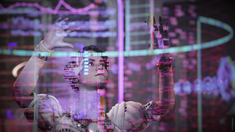 Alva interacts with a large holographic projection as she pores over the new data available to her at the Base.