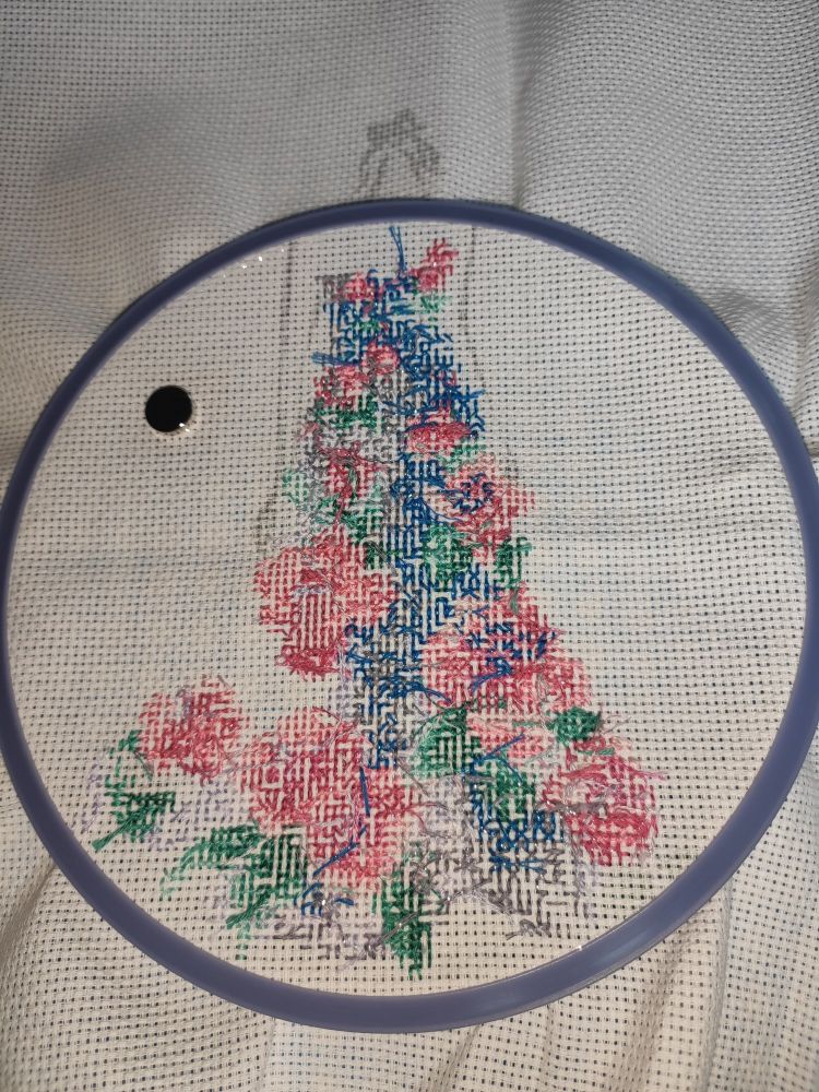 The same cross-stitch from the back, showing progress better as there's no printed pattern to obscure the progress.