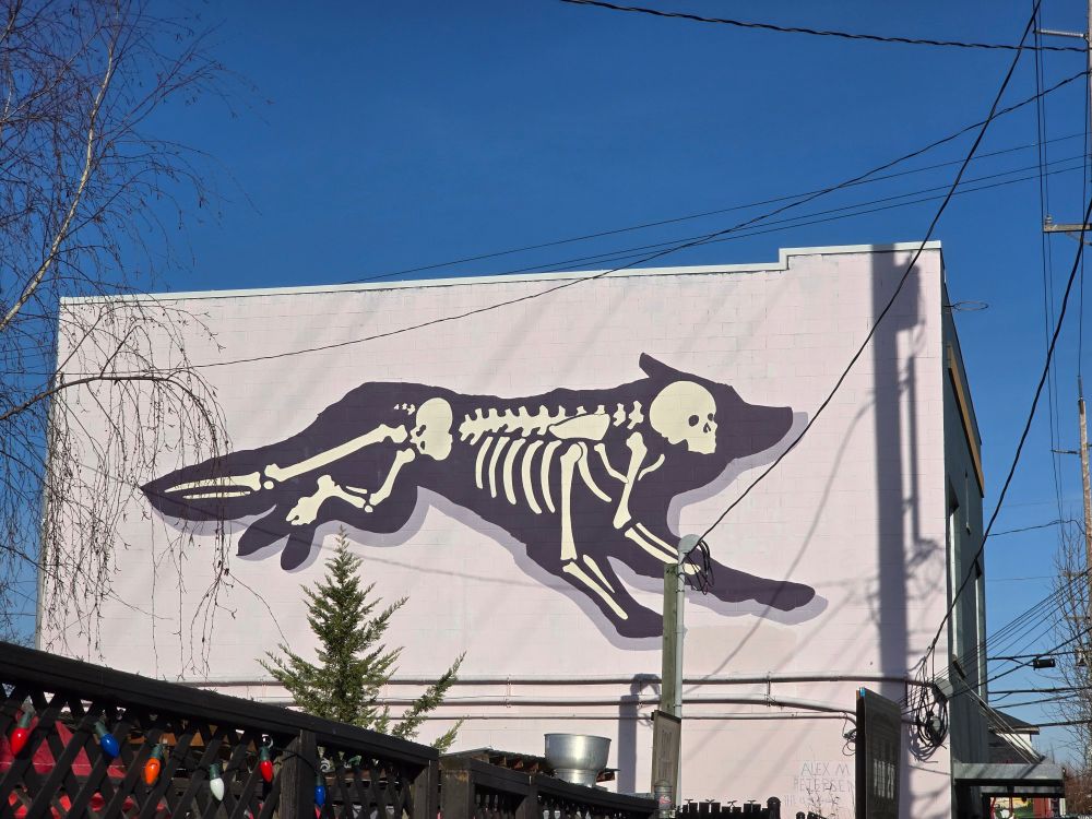 Human skeleton in a dog body mural