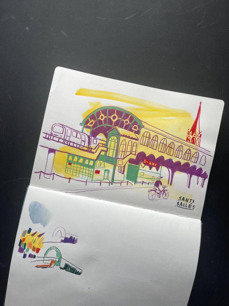 A drawing of Görlitzer Bahnhof in a sketchbook on to, on the bottom are some scribbles to test the colour combinations.