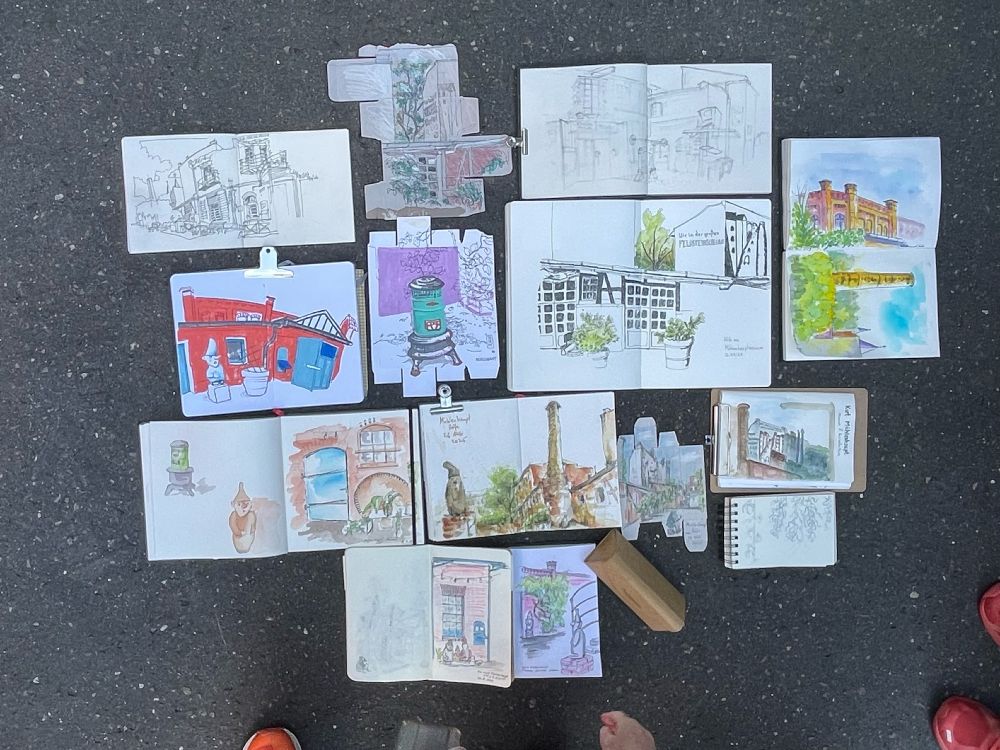 Throwdown of sketchbooks and cardboard boxes.