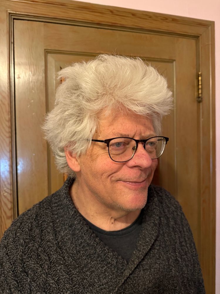 Man with a full head of white hair