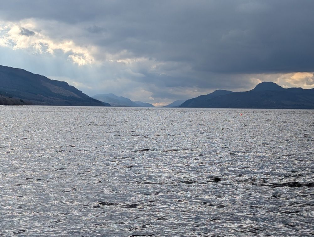 Loch Ness in front of cloud covered hills