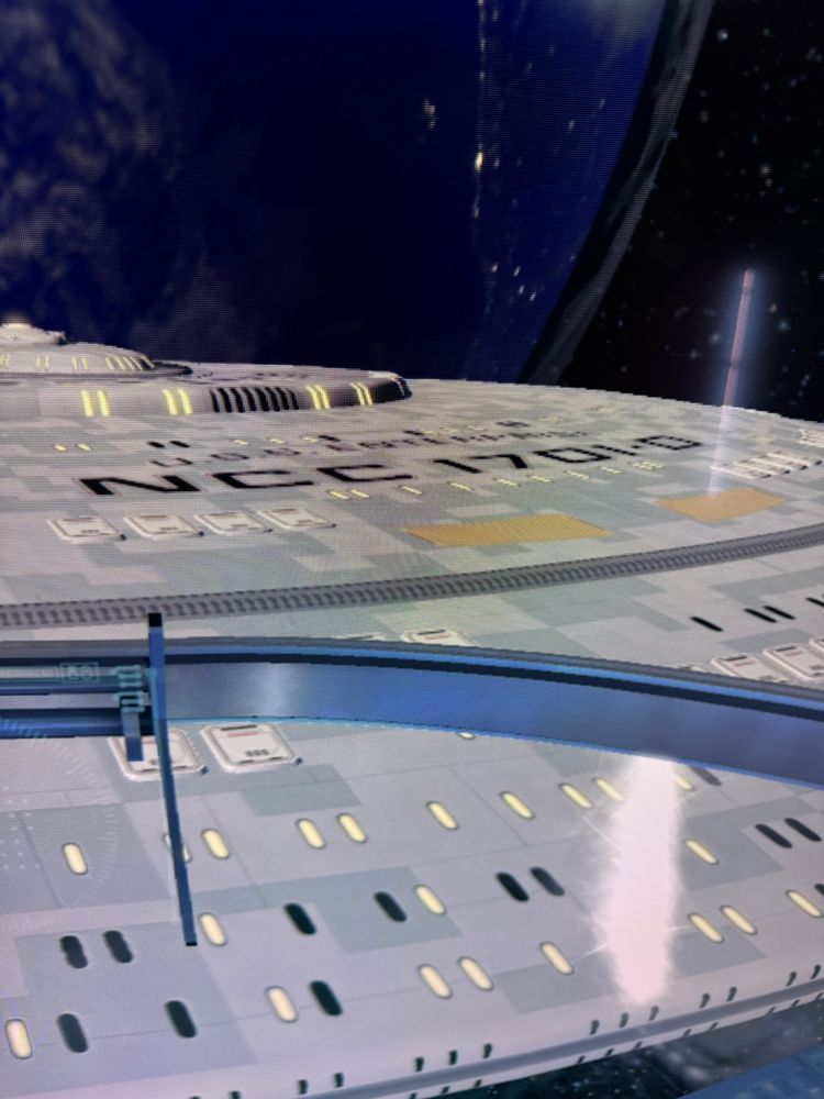 A close-up of the USS Enterprise NCC 1701-D as seen in Star Trek Bridge Commander. The designation is visible on a light coloured hull. 