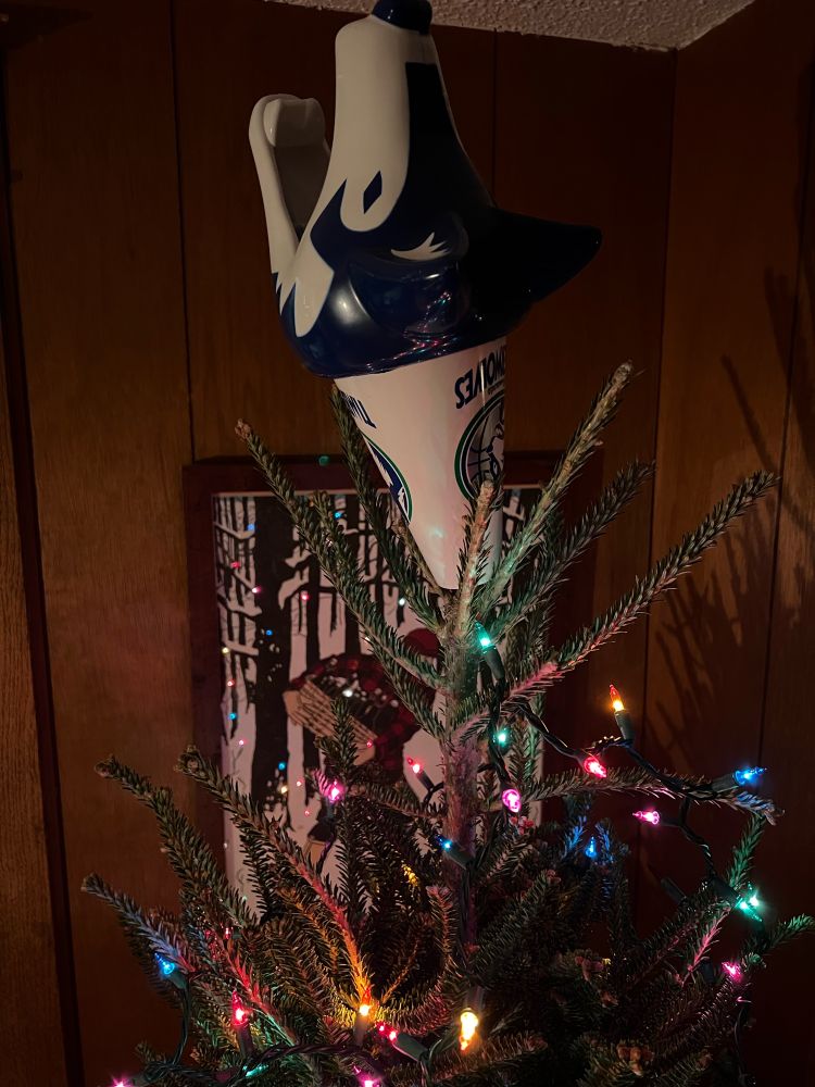 A Christmas tree topped with a Timberwolves crunch howler