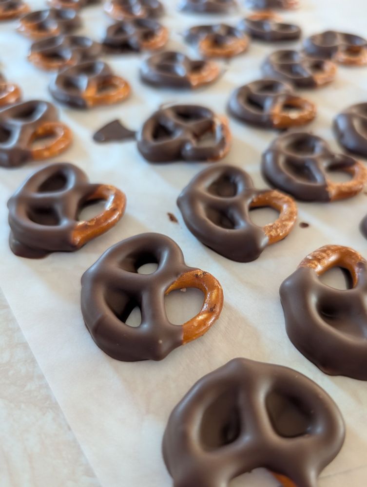 A picture of pretzels dipped in chocolate 