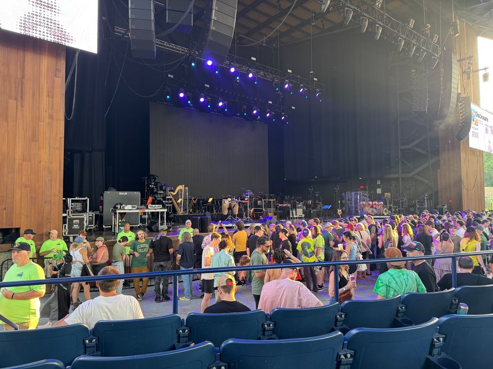 Photo of the stage at Merriweather Post Pavilion, from the front five rows of section 202
