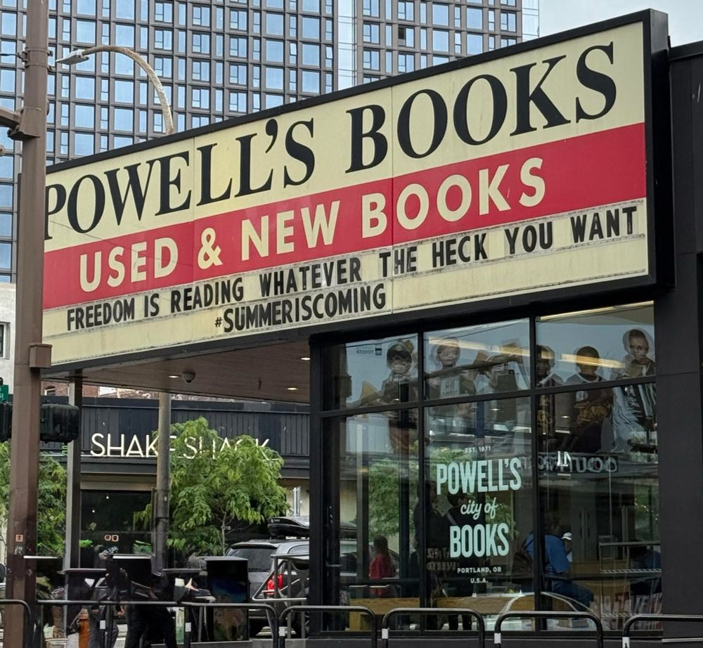 Powell’s Books sign for their used and new bookstore. “Freedom is reading whatever the heck you want” summer is coming 