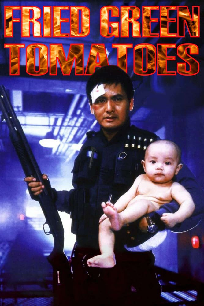 Chow Yun Fat Holds a shotgun and a huge baby. Behind him the words "FRIED GREEN TOMATOES" written in block letters filled with fire.