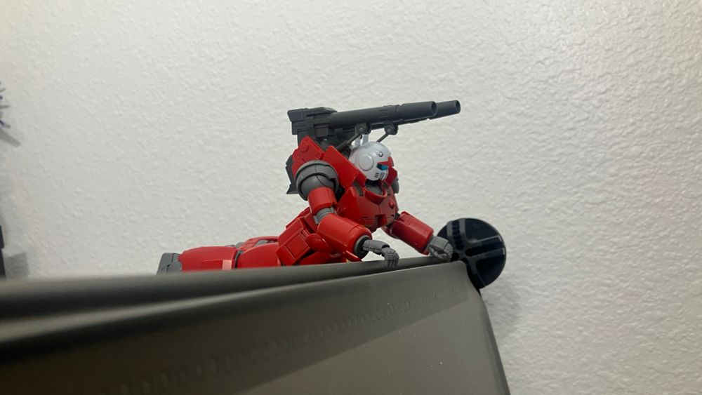 Hg Origin Guncannon in a laying down shooting pose