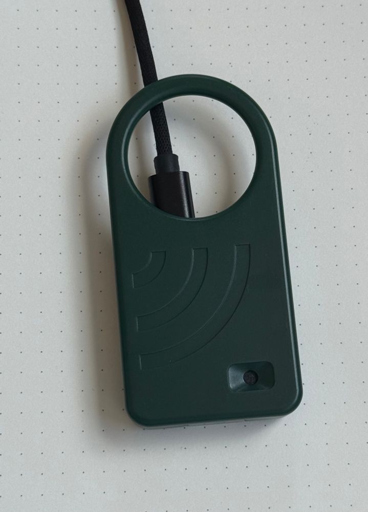 A photo of an AudioMoth USB Microphone that is running the AudioMoth Altair 8800 simulator.