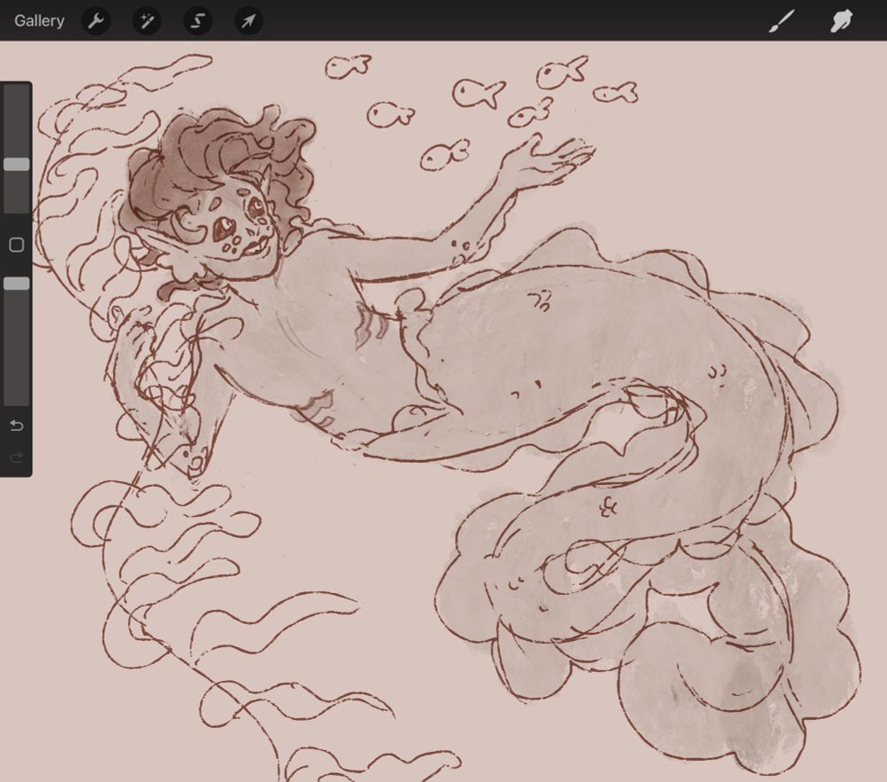 A merperson with a long, frilled, eel-like tail grips a piece of sea kelp while reaching towards a passing school of fish