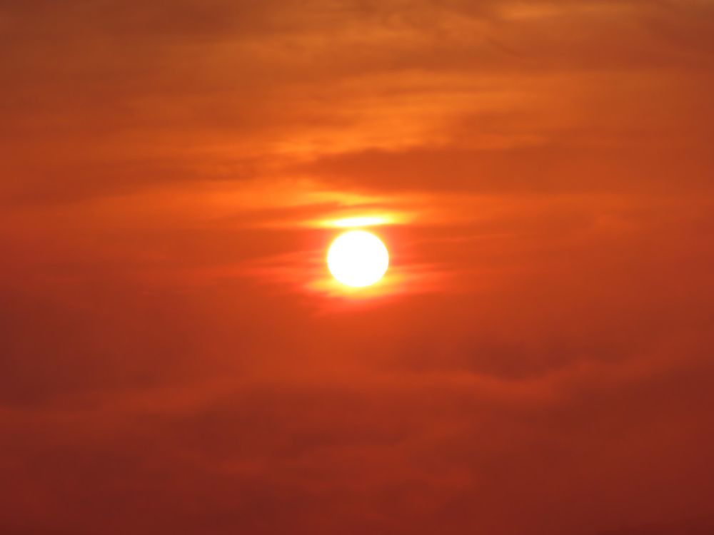 Sunrise above the clouds from the terrace of the hotel.