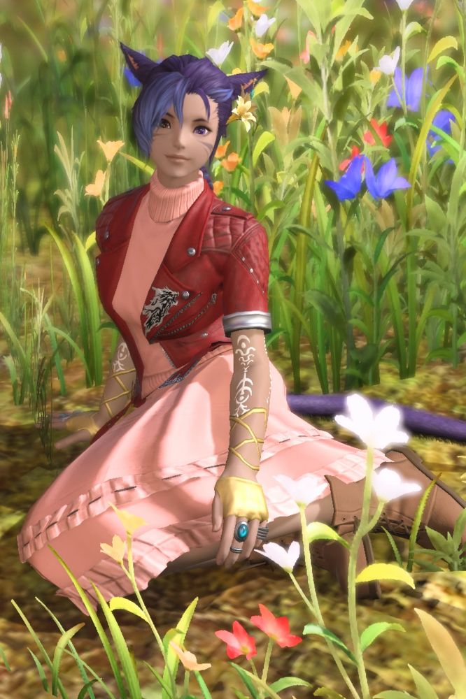 A purple haired Miqo'te (humanoid cat-like race from Final Fantasy XIV) woman dressed like Aerith Gainsborough from Final Fantasy VII in a pink dress, red short sleeved jacket, and brown ankle boots sits among a field of flowers.