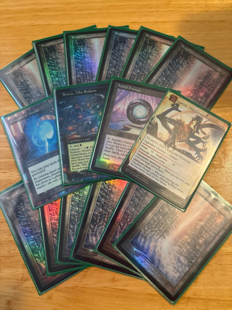 Magic: the Gathering proxies; 12 snow-covered forests, an Ulamog, the Ceaseless Hunger, a Crucible of Worlds, a Boseiju, Who Endures, and a Fabled Passage