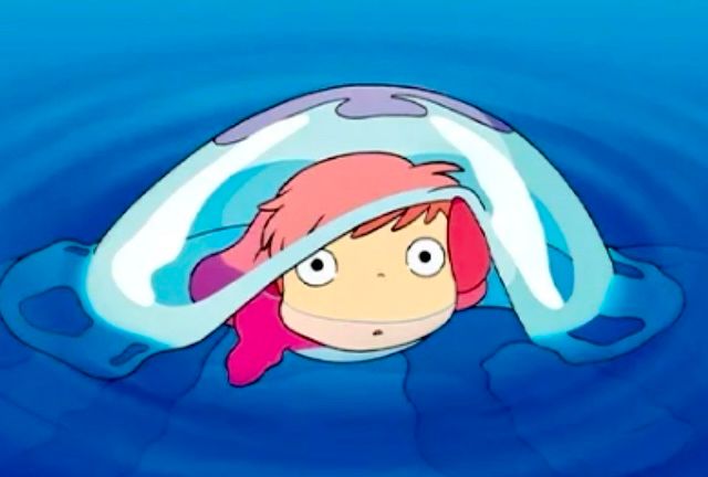 The anime character Ponyo floating in the ocean 