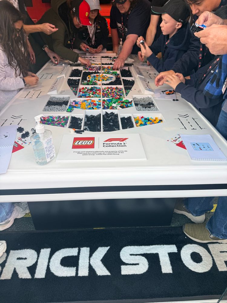 Lego Formular car Building station with carpet that says Brick Stop